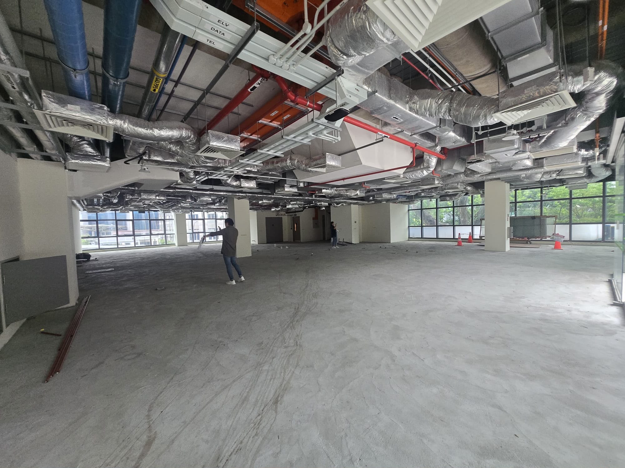 Commercial unit fully stripped out to bare condition with exposed ceiling services, Singapore
